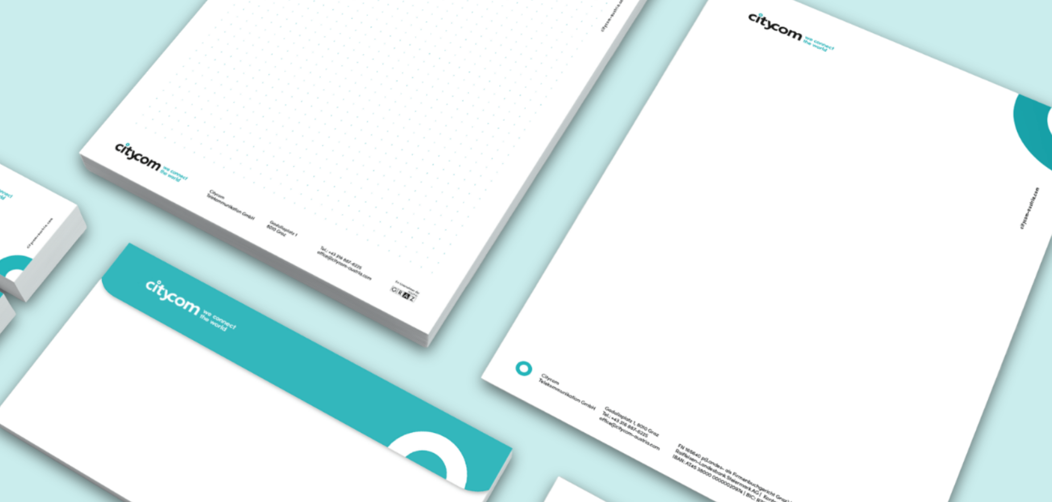 Citycom Geschäftsdrucksorten: Schreibblock, Briefpapier, Kuvert und Visitenkarte.
